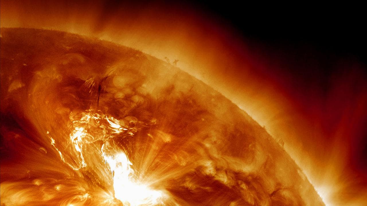 A solar flare erupting on the sun's northeastern hemisphere