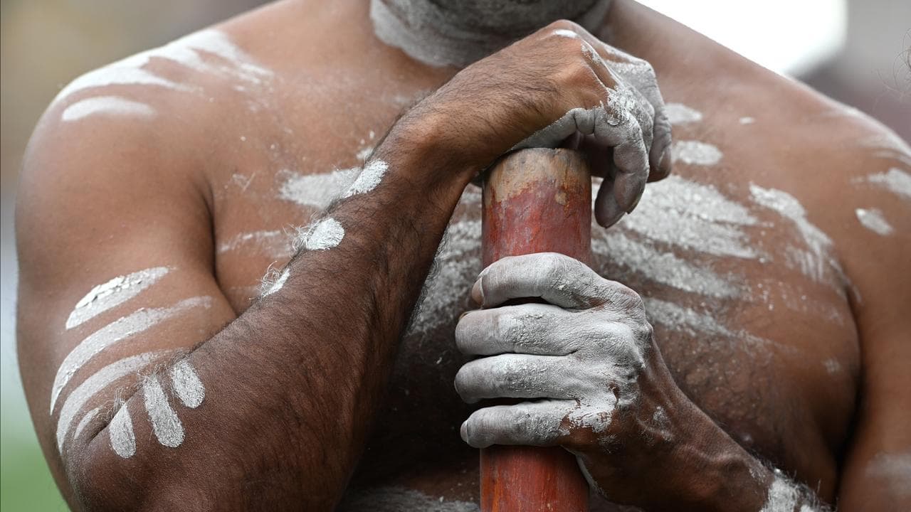 An Indigenous man holding a didgeridoo (file image)