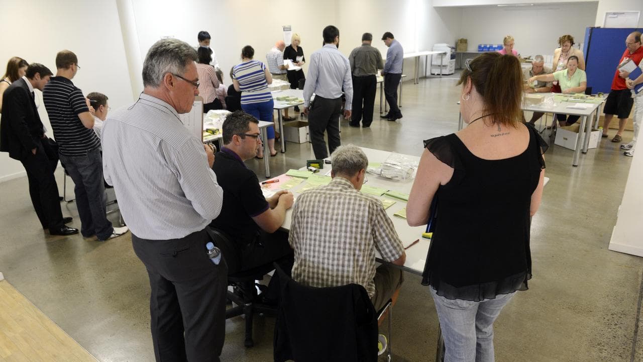 Scrutineers watch over as officials count votes (file image)