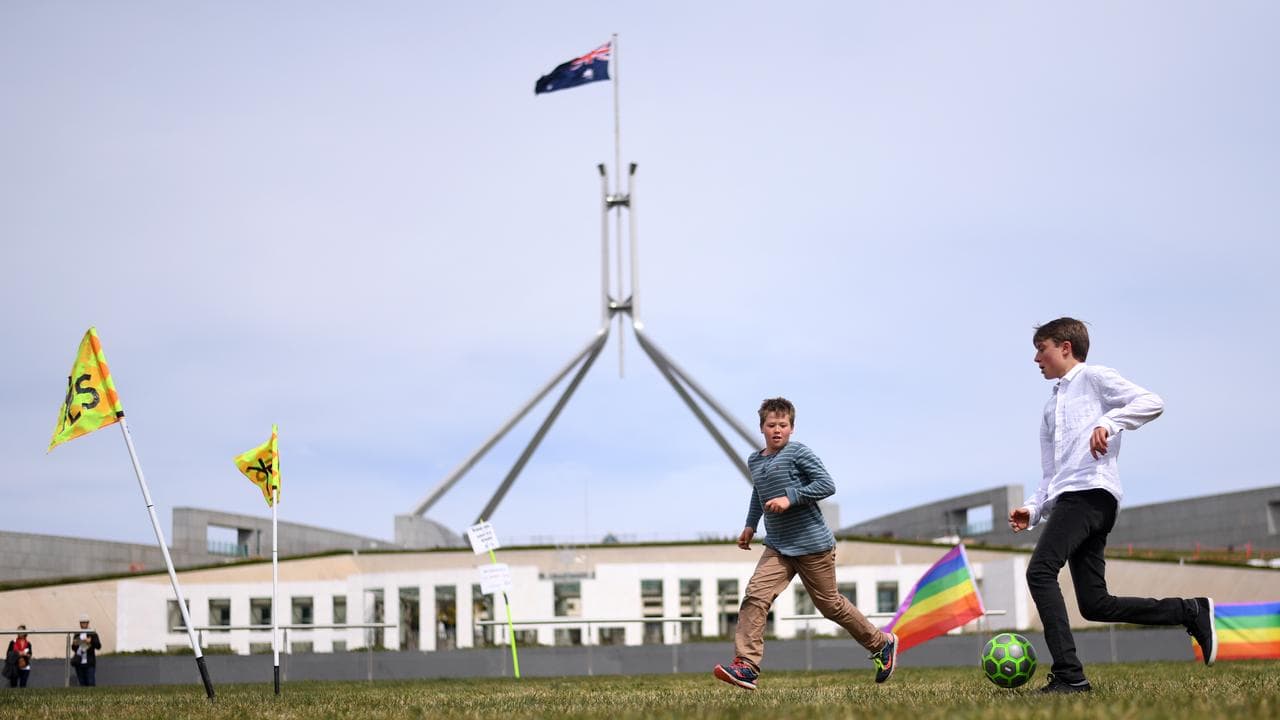 Kids playing soccer in front of Parliament House (file image)