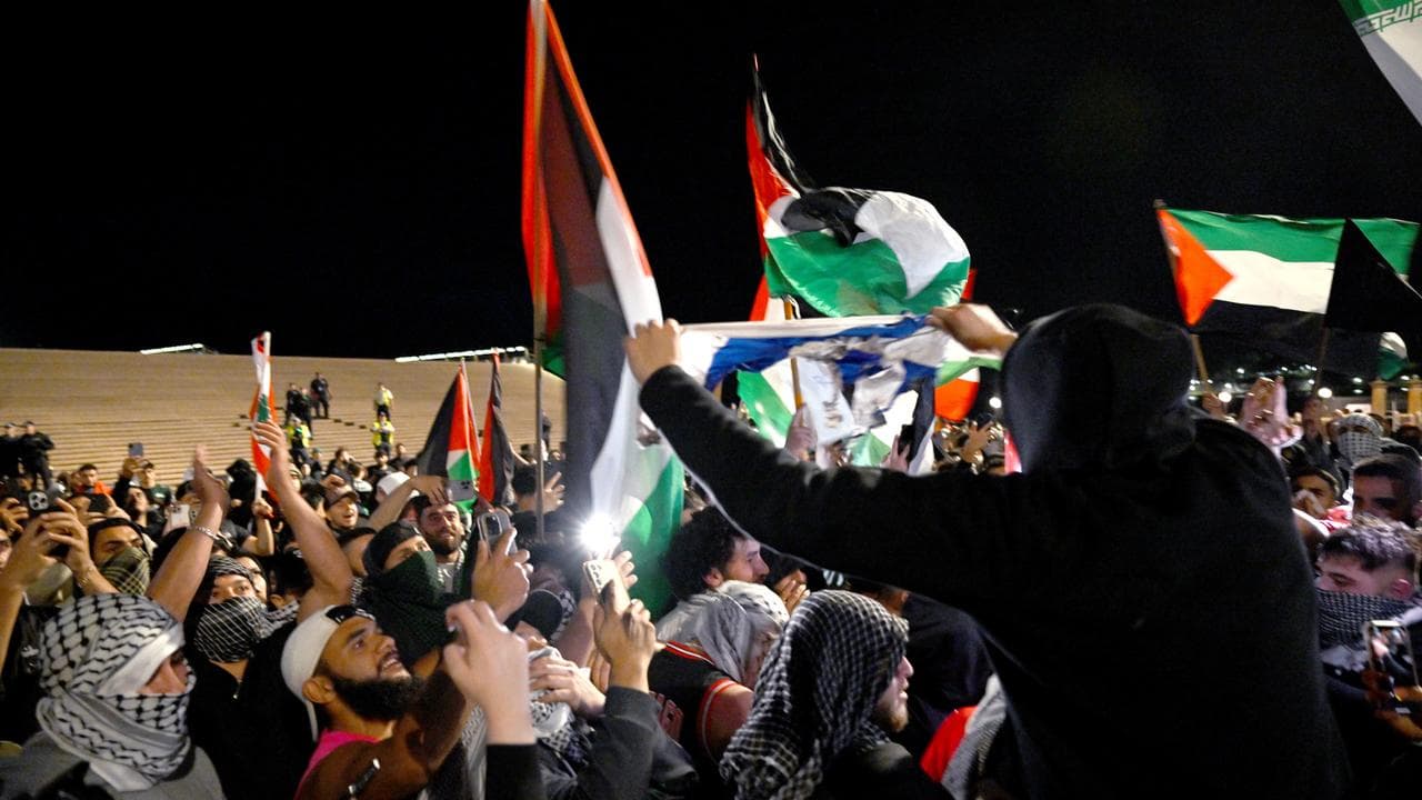 Protesters burned the Israeli flag.