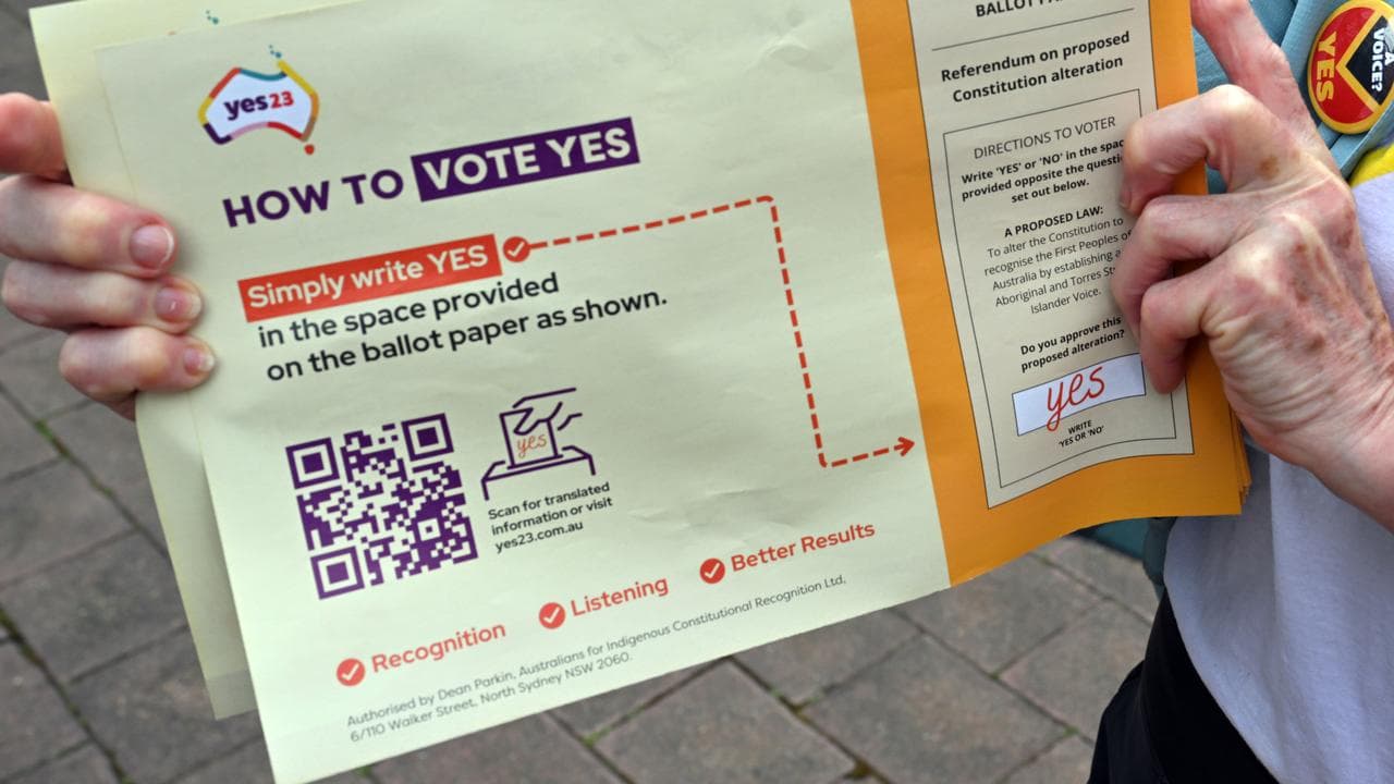 A volunteer holds a Yes pamphlet (file image)