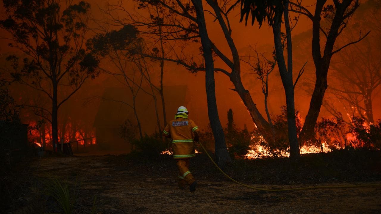 Firefighter battles blaze in NSW