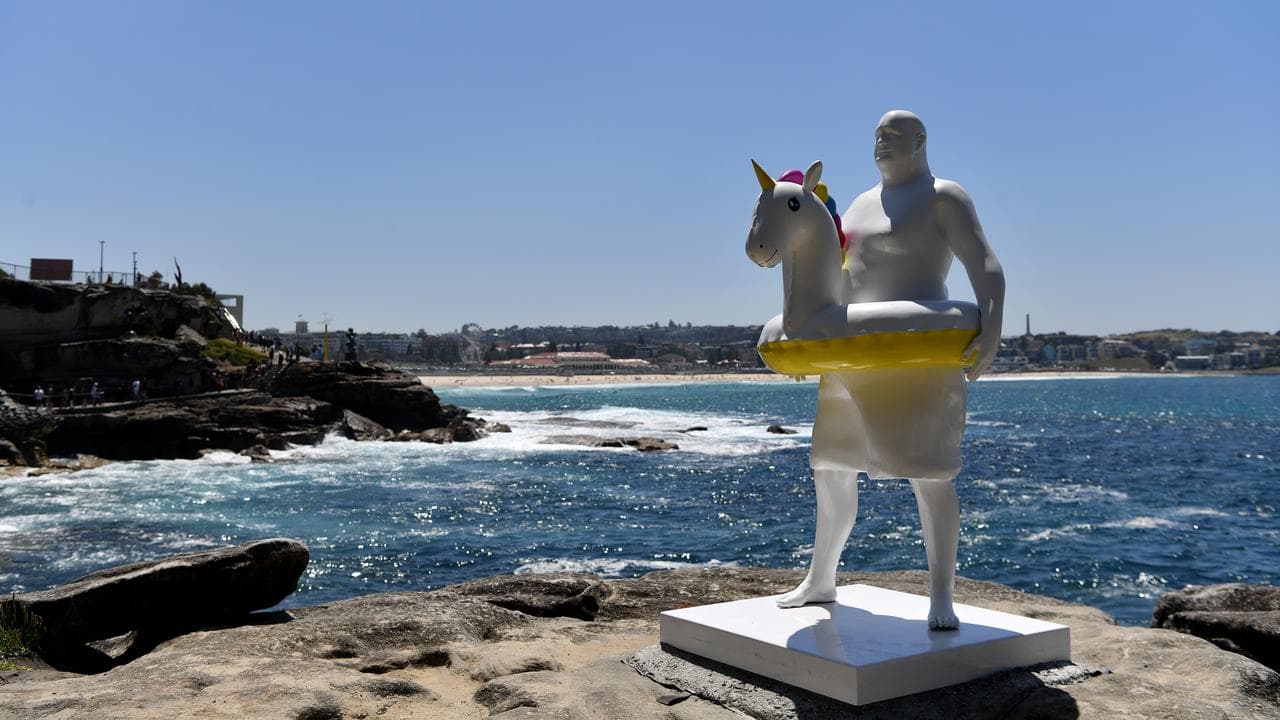 Sculpture of man with unicorn life ring