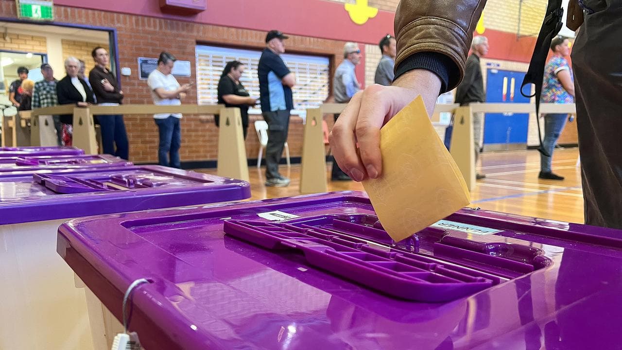 Someone casting a vote