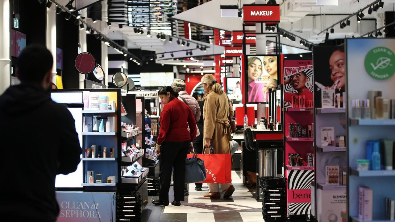 Shoppers browse goods for sale at a retail store (file image)
