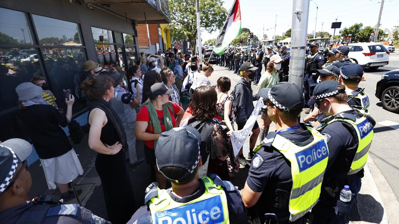 Pro-Palestine protesters are surrounded by police