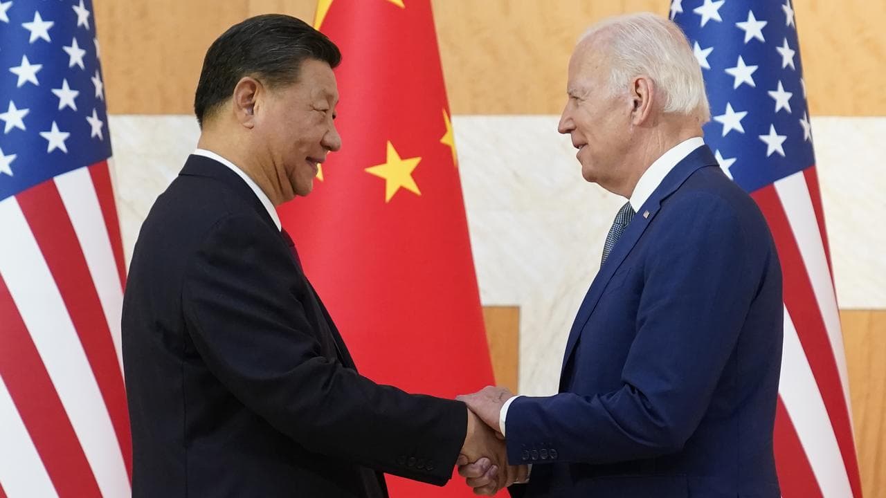 A file photo of Xi Jinping and Joe Biden