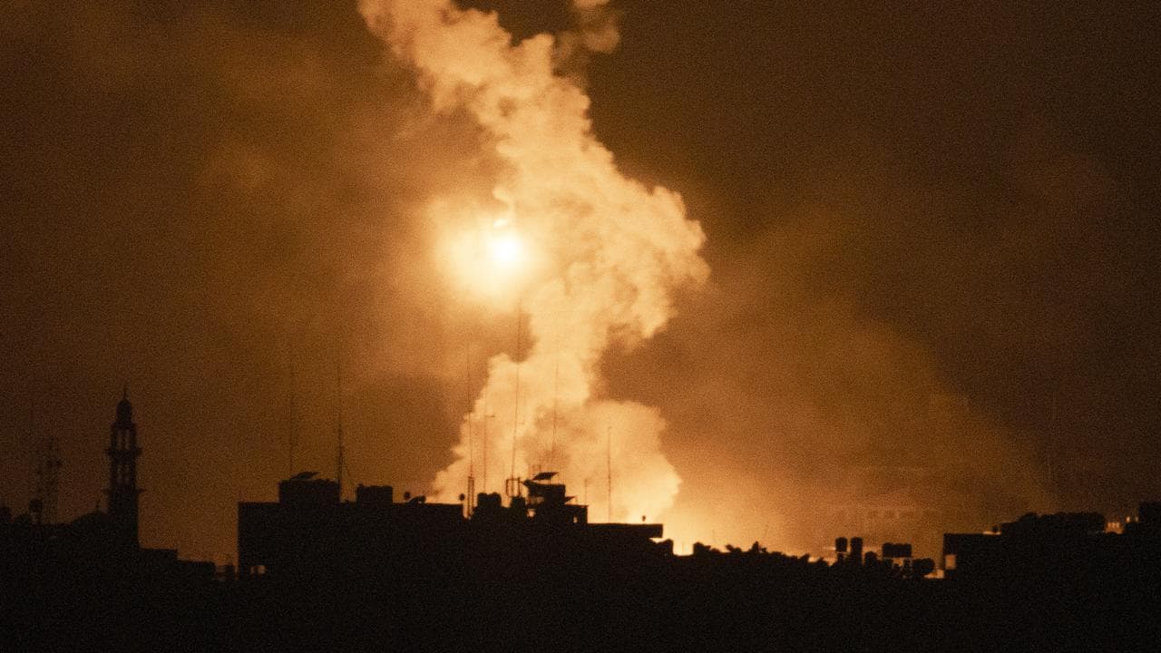 Flares rise over the Gaza Strip, as seen from southern Israel