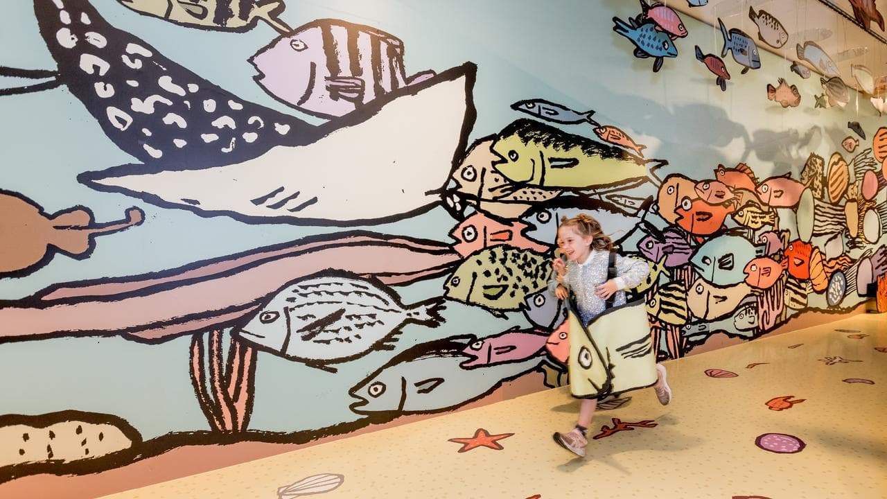 A child plays in the exhibition.