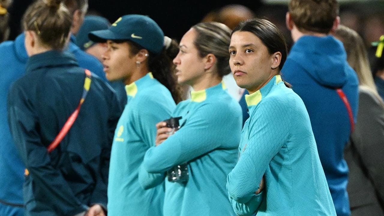 Mary Fowler, Kyah Simon and Sam Kerr at pitchside during the World Cup