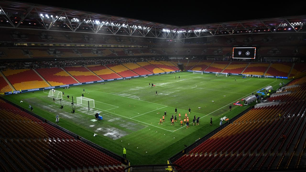 Puddles on the pitch at Suncorp Stadium. 