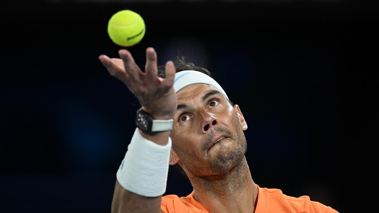 Rafael Nadal serves at the 2023 Australian Open.