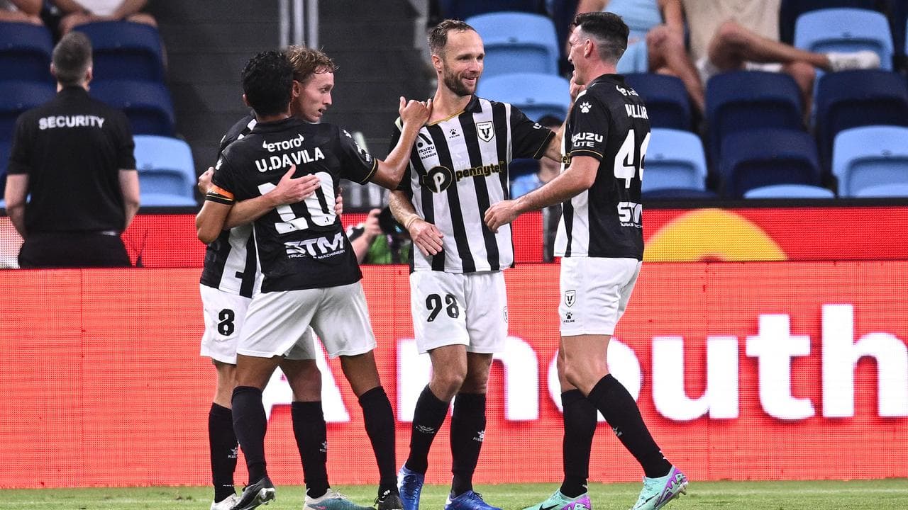 Macarthur players celebrate Jake Hollman's goal.