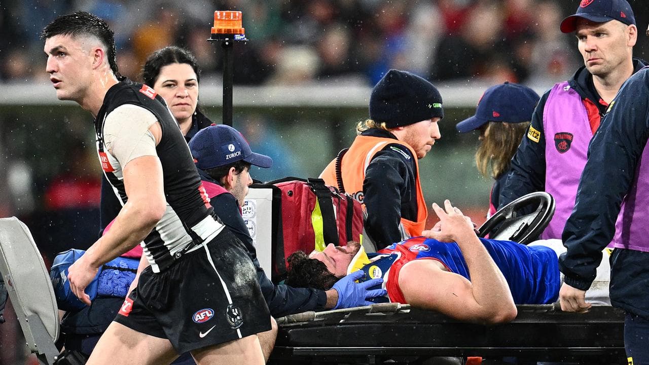 Collingwood's Brayden Maynard, left, checks on Angus Brayshaw