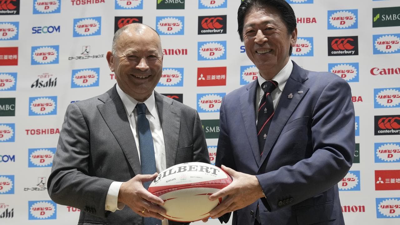Australia's Eddie Jones (left) with Masato Tsuchida.