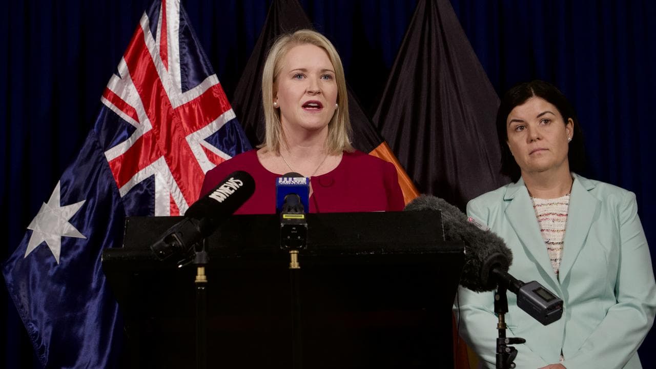 Nicole Manison at podium with Natasha Fyles