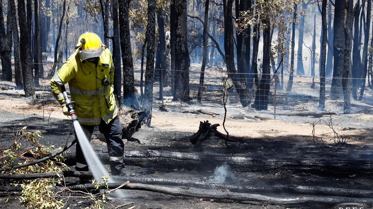 A WA firefighter mops up.
