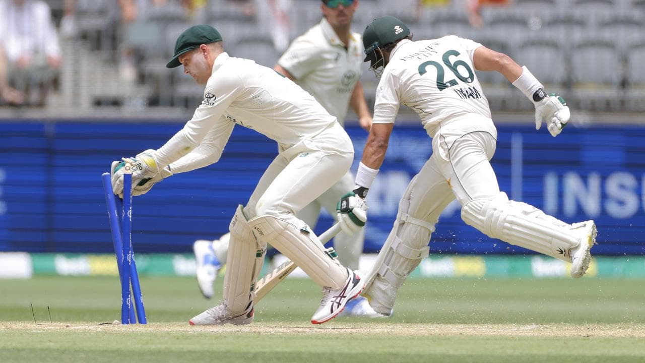 Australian keeper Alex Carey (left)