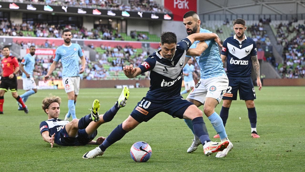Bruno Fornaroli under pressure from Aziz Behich.