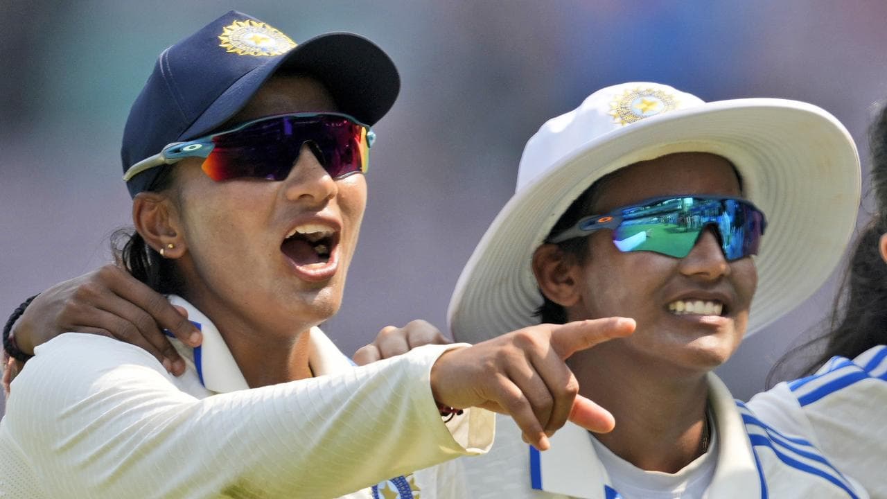 Sneh Rana (left) took 4-63 as India cleaned up Australia for 261.