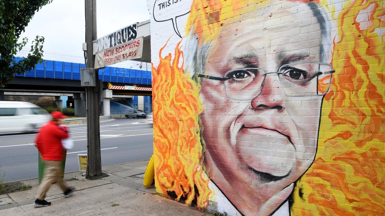 A mural of Scott Morrison among flames.