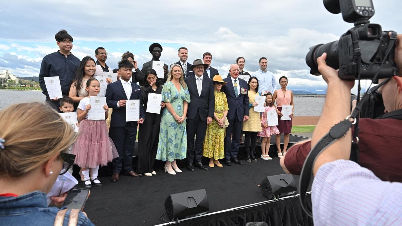 The PM and governor general with newly sown citizens.