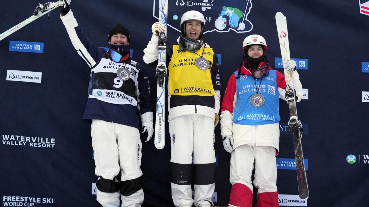 Australian skiier Cooper Woods (left)