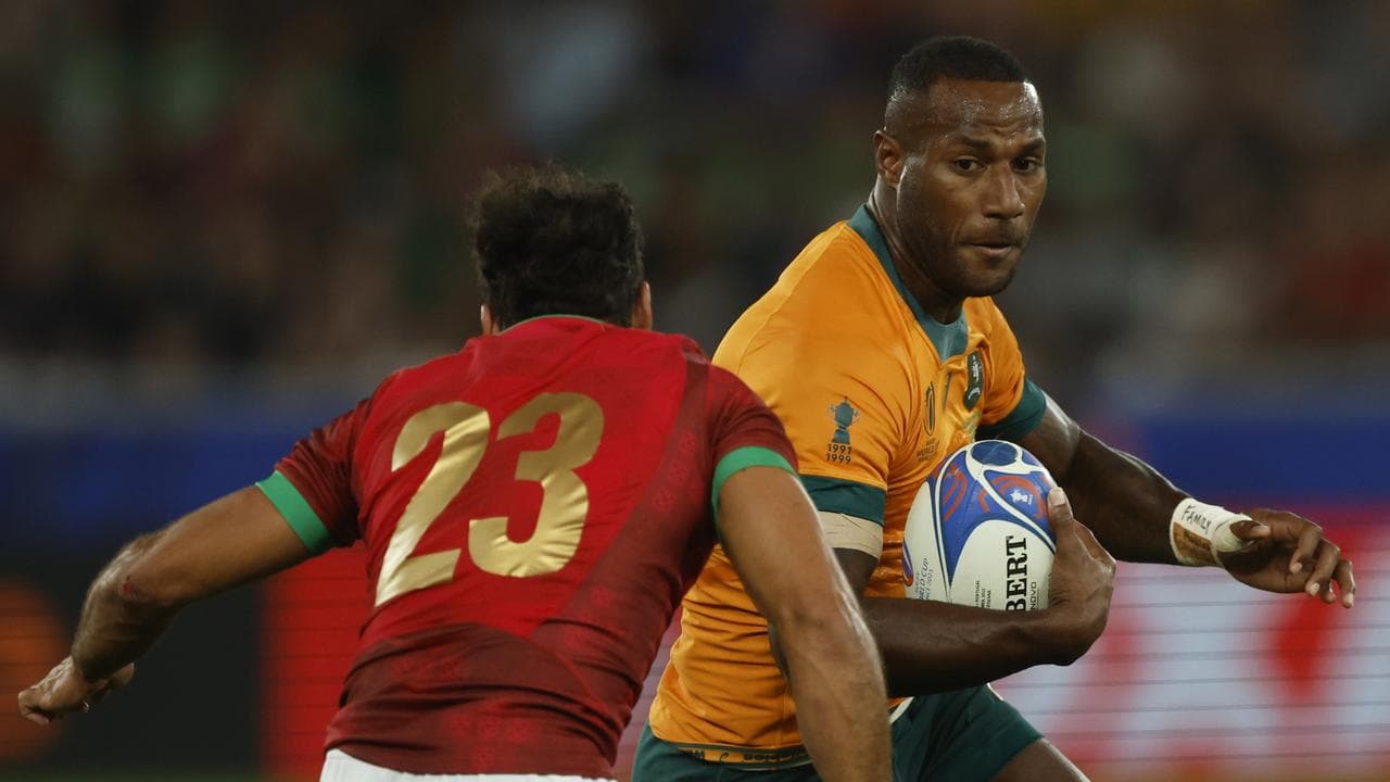 Vunivalu runs with the ball for the Wallabies at the World Cup.