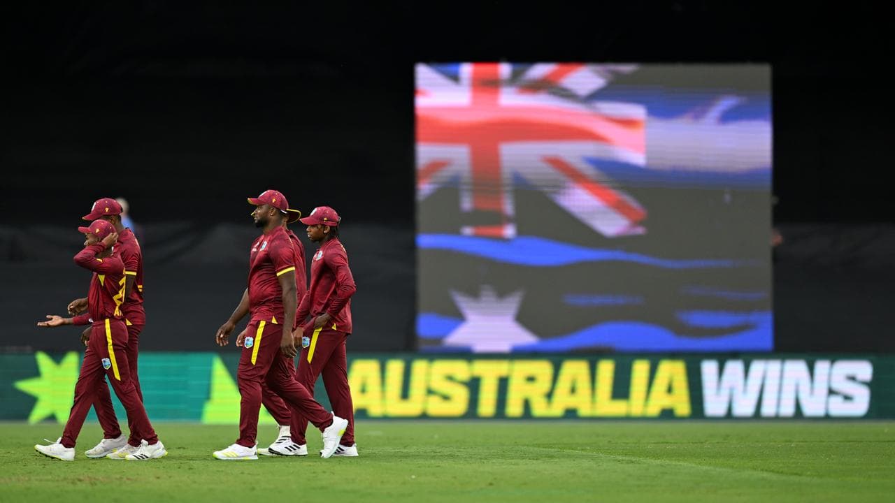 West Indies players leave the field.
