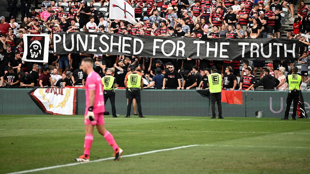 Western Sydney Wanderers fans with banner.