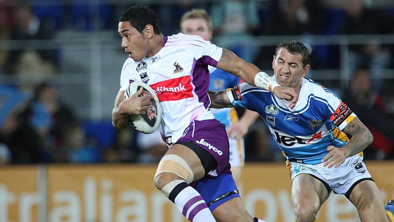 Joseph Tomane gets away from Mat Rogers.