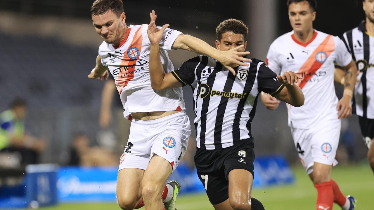 Curtis Good and Raphael Borges Rodrigues compete for the ball.