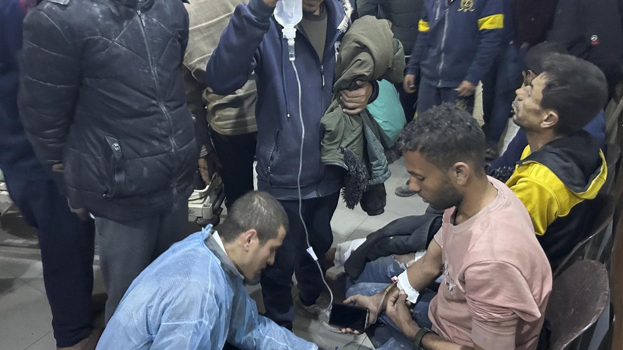 Palestinians in a food aid queue wounded