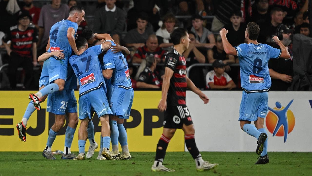 Sydney FC players celebrate a goal.