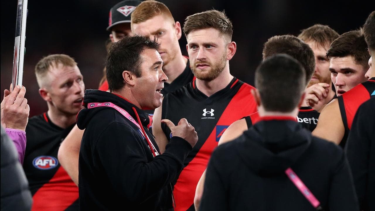 Essendon coach Brad Scott (left). 