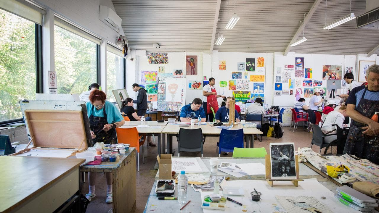 Artists with intellectual disabilities work at Arts Project Australia.