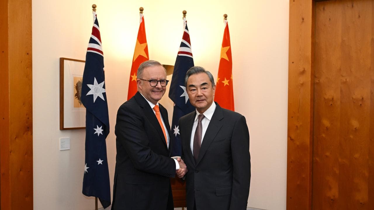 PM Anthony Albanese shakes hands with Chinese Foreign Minister Wang Yi