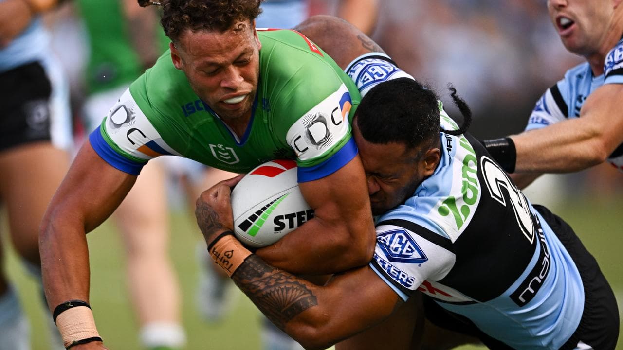 Sione Katoa pulls of a superb tackle on Sebastian Kris.