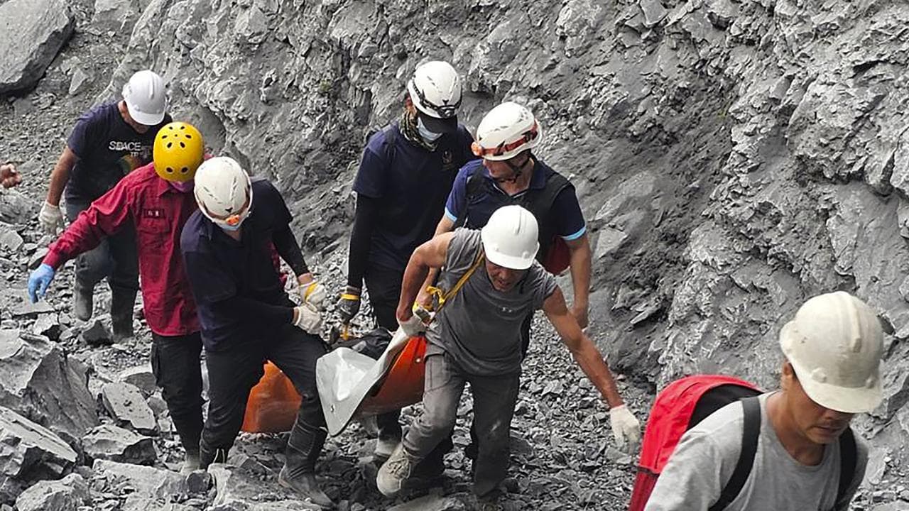 A body is retrieved from a quarry after a earthquake hit Taiwan