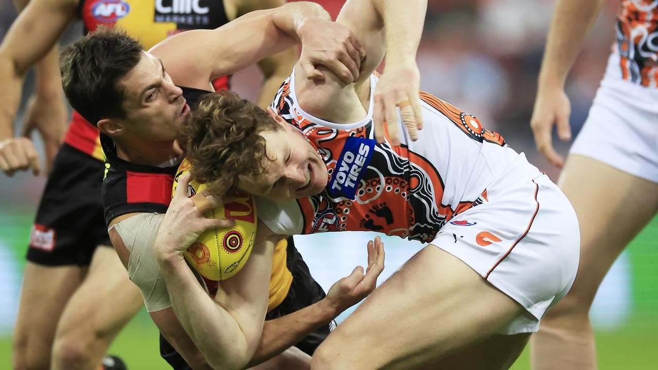 Jack Steele tackles Tom Green.