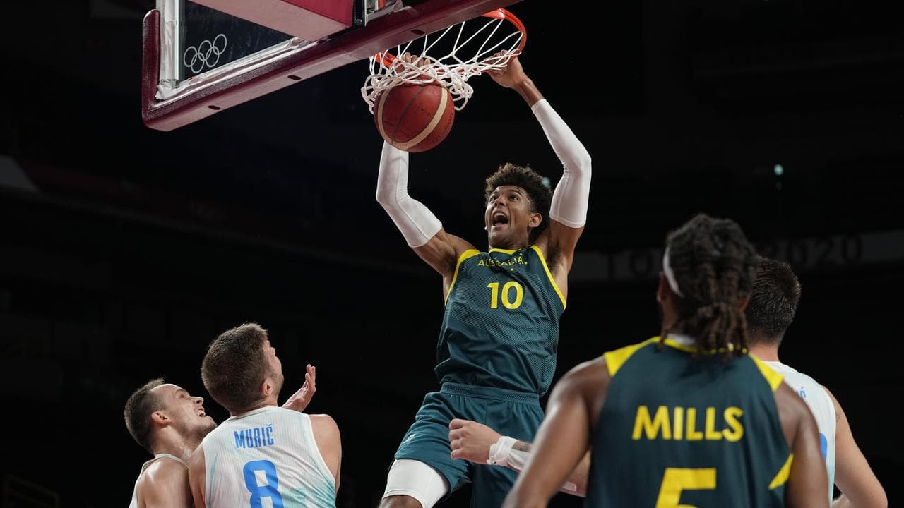 Matisse Thybulle (10) dunks for the boomers v Slovenia at Tokyo 2020.