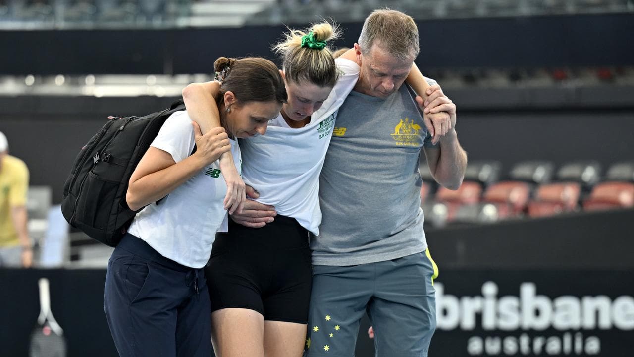 Storm Hunter is helped off court after her injury. 