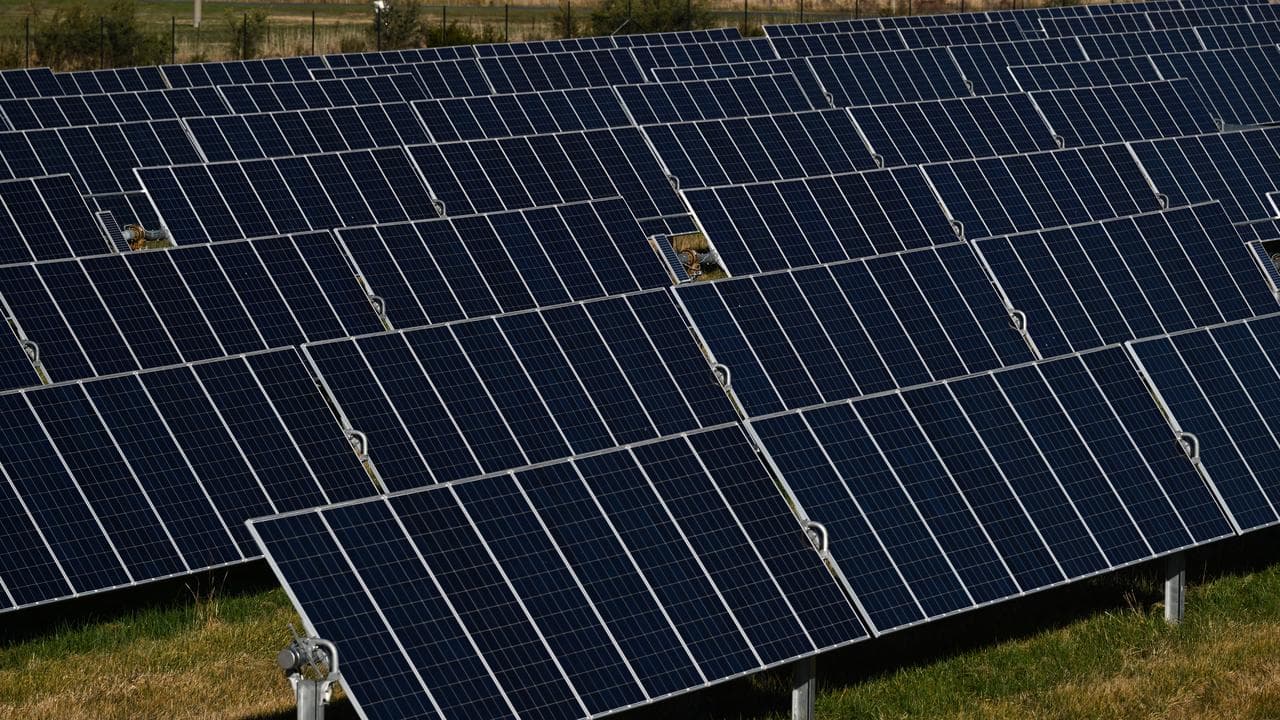 Solar panels at a solar farm on the northern outskirts of Canberra