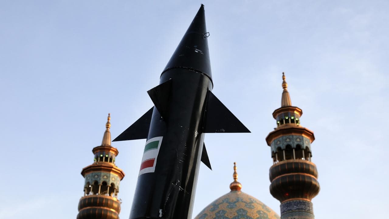 A model of a missile is carried by Iranian demonstrators in Tehran
