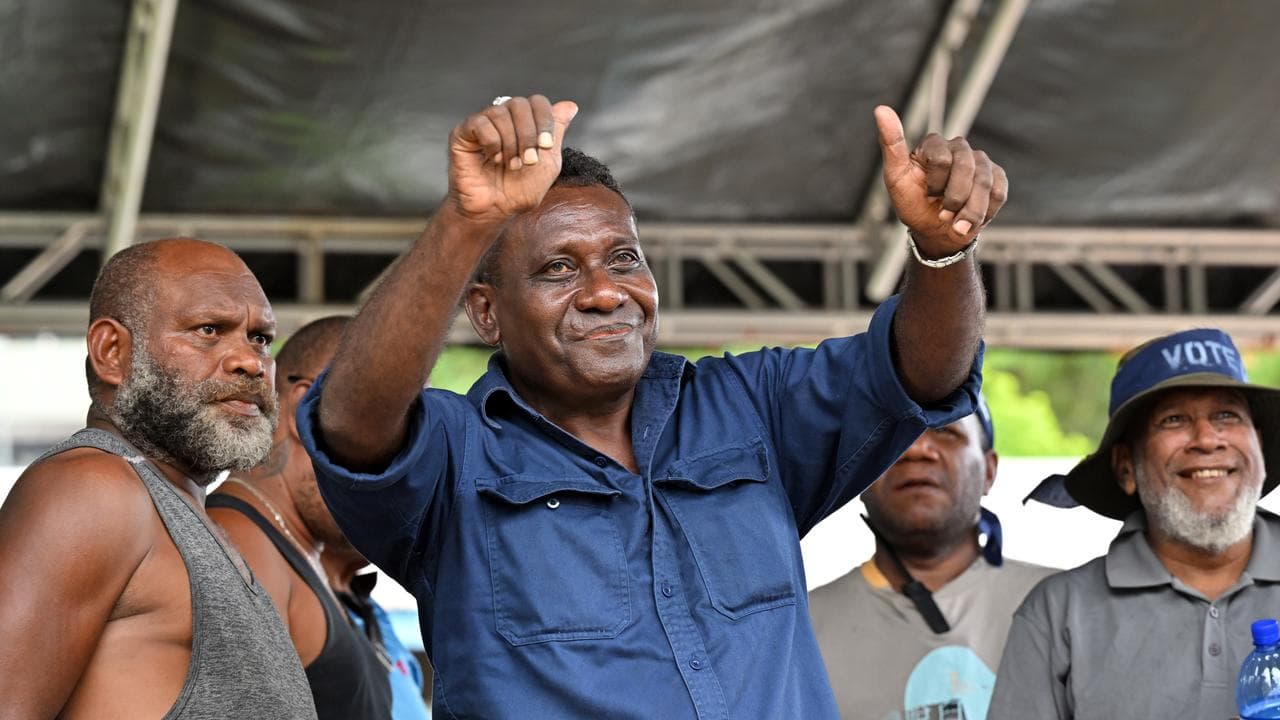 Gordon Darcy Lilo gives a thumbs-up to a crowd