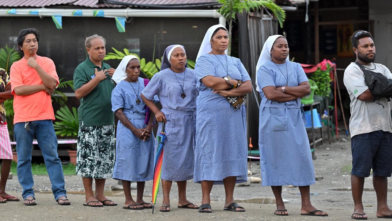 Nuns queue at a polling station in Honiara, Solomon Islands