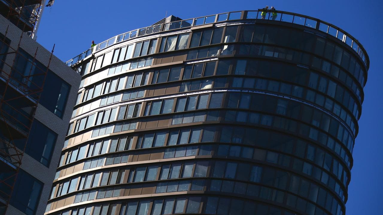 Construction workers at residential apartment block.