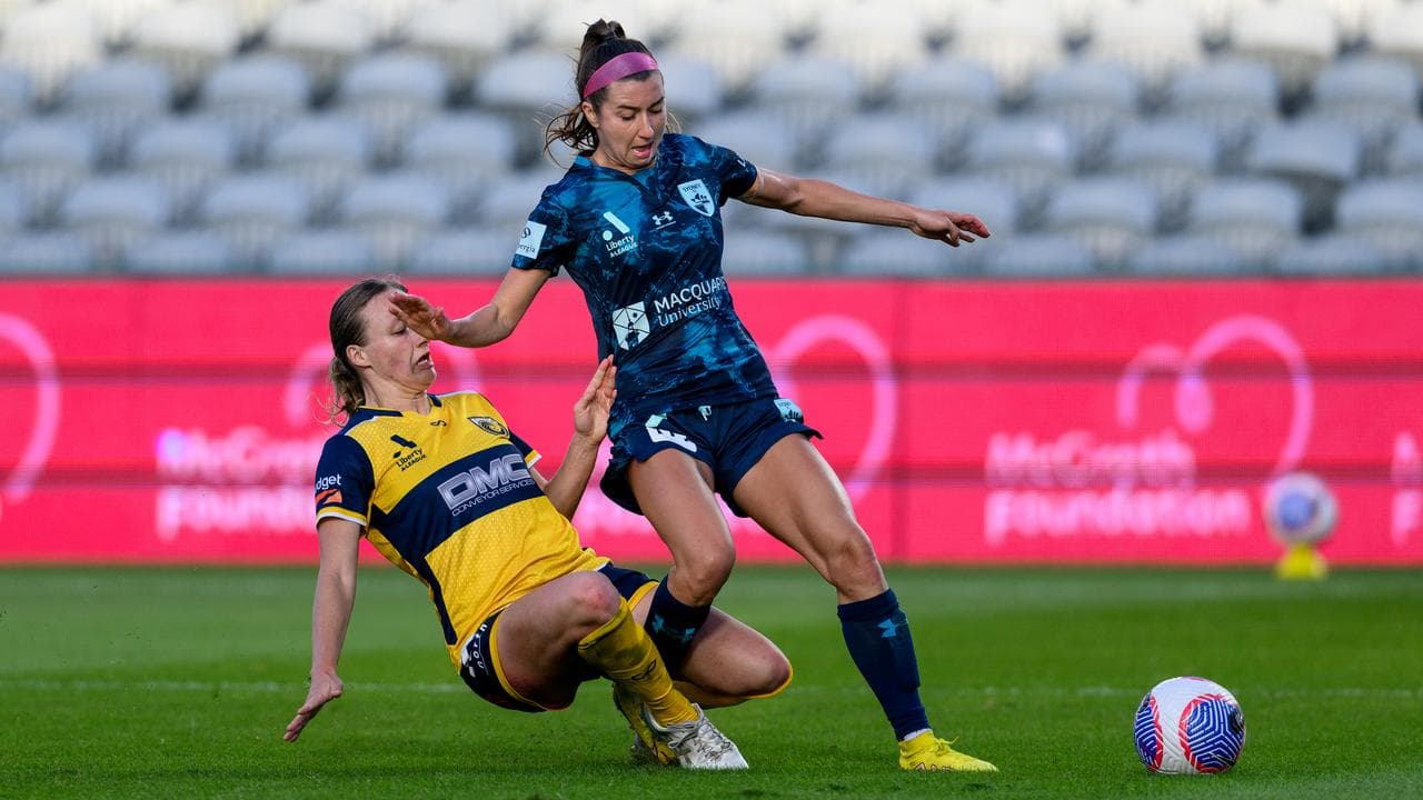 CCM's Ashley Irwin tackles Sydney FC's Shea Connors. 