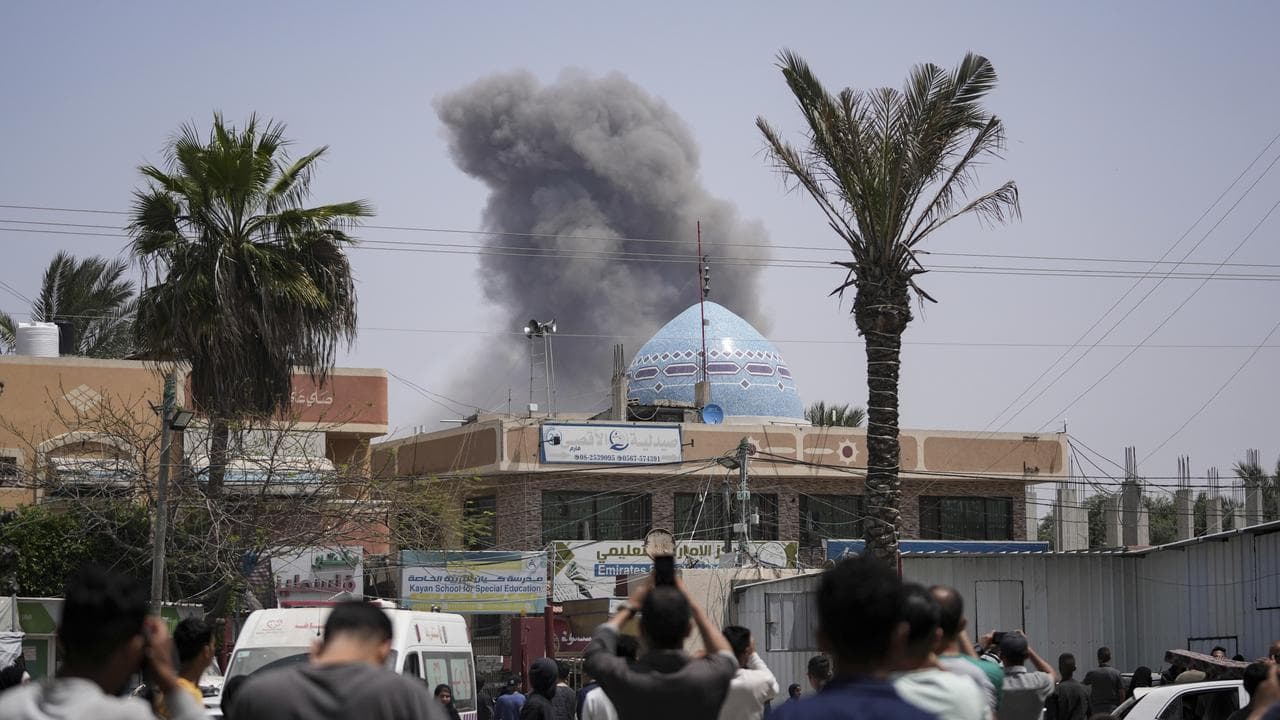 Smoke rises following an Israeli strike in Deir al Balah, Gaza Strip
